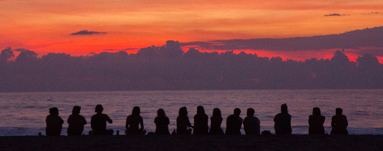 Group of friends by sunset