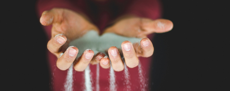 Sand through fingers