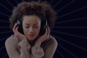 Woman praying with headphones