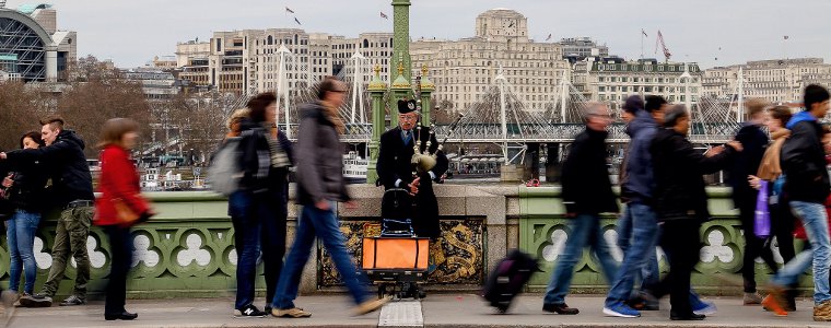 People hurrying on a London Bridge